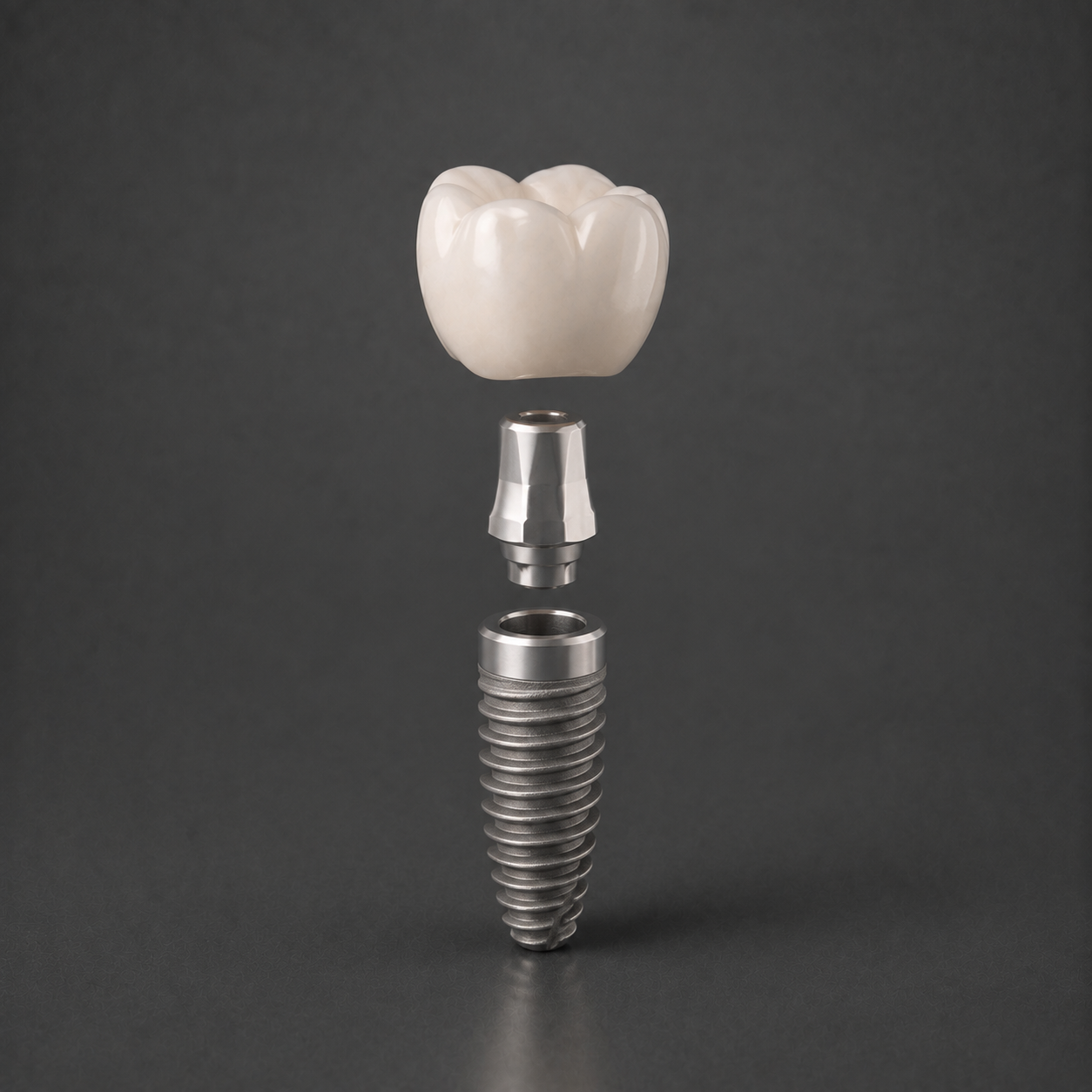 Titanium dental implant with abutment and porcelain crown shown in exploded view